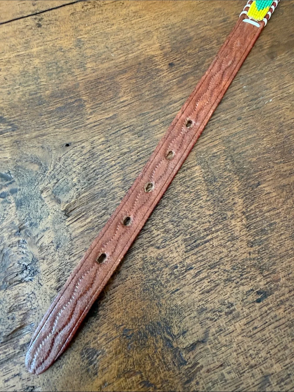 Child’s souvenir beaded belt with brown leather